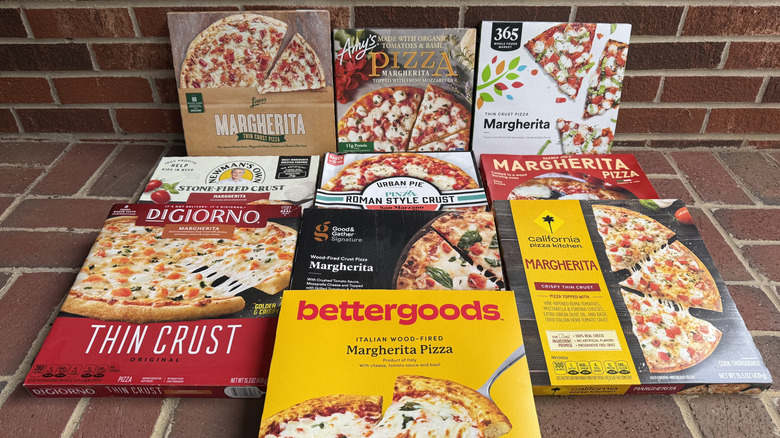 10 Margherita pizzas from different brands, lined up on brick surface
