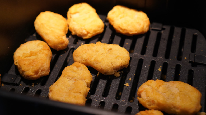 closup of chicken nuggets in an air fryer