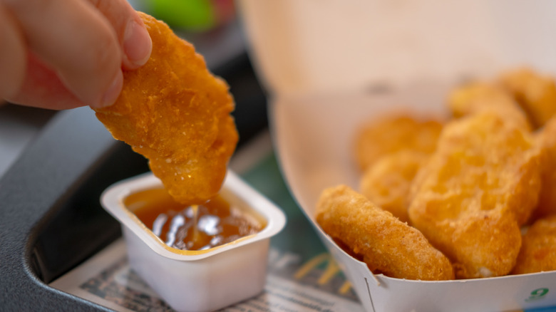 McDonald's chicken nuggets dipped in sauce