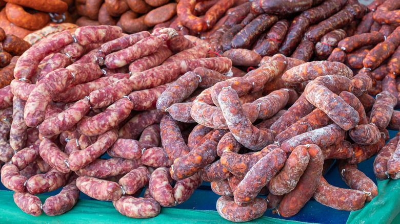 different types of Spanish chorizos and morcillos laid out on a table