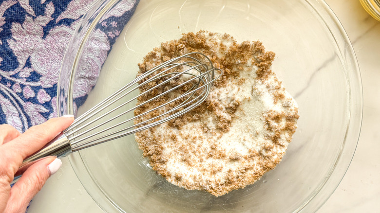 hand whisking the sugars