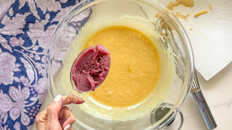 hand adding ube halaya