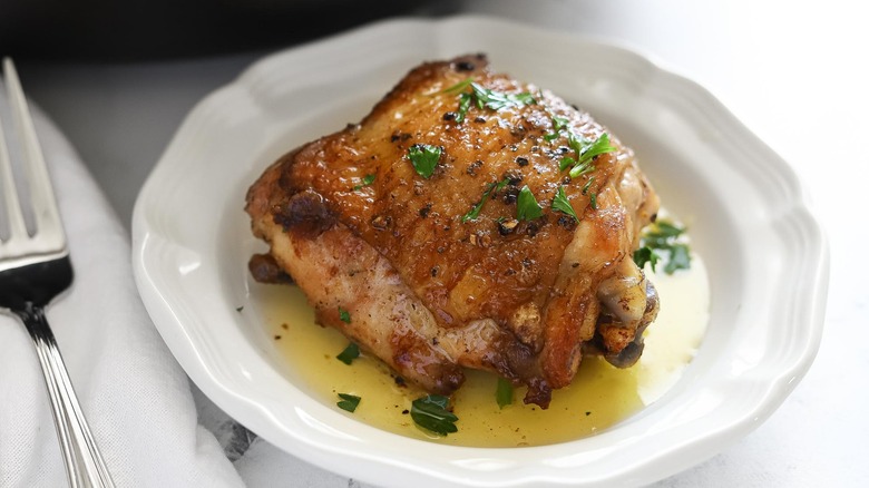 garlic butter chicken thigh on plate 