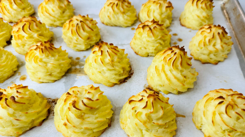Duchess potatoes on baking sheet