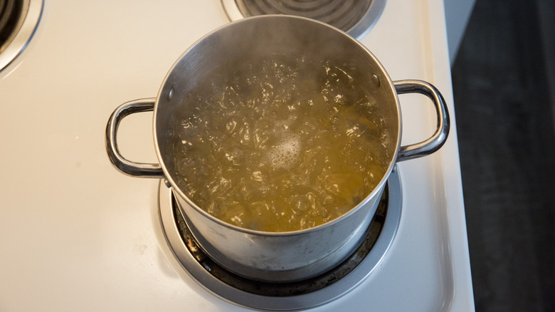spaghetti cooking in large pot