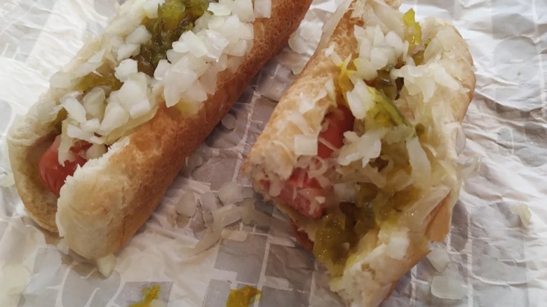 Two hot dogs with onions and relish
