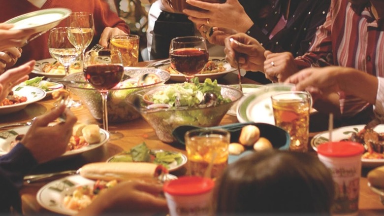diners eating salads and pasta at olive garden