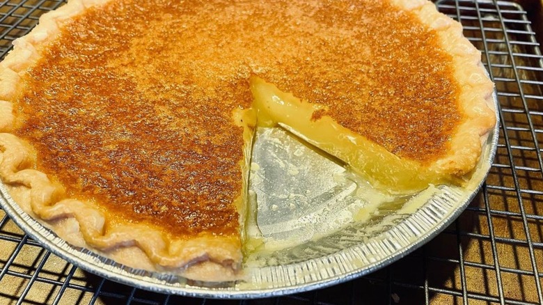 transparent pie with slice cut out on a cooling rack