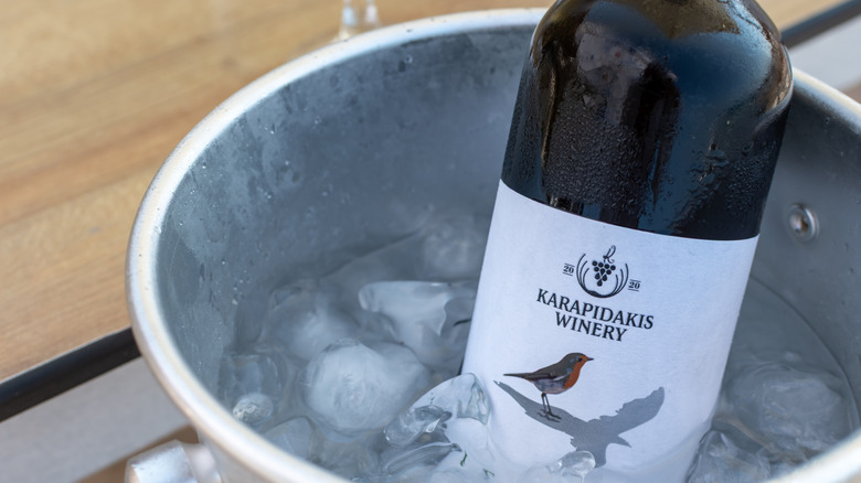 Overhead view of bottle of whine chilling in an ice bucket