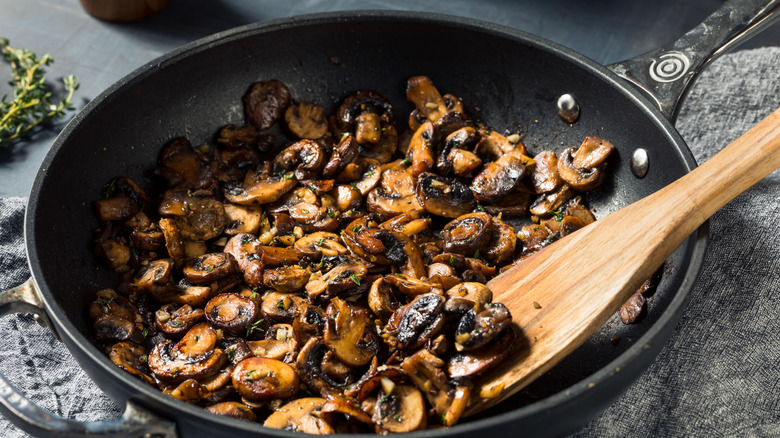 Sautéed mushrooms in pan