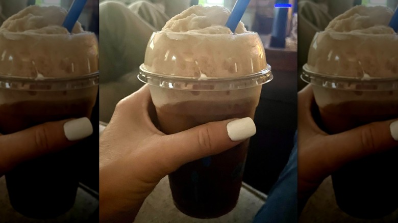 Hand holding Culver's root beer float
