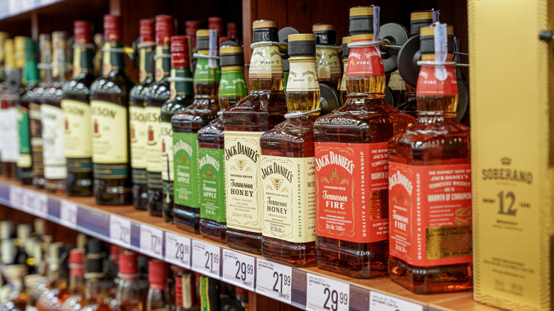 Bottles of Jack Daniel's on display on a store shelf.