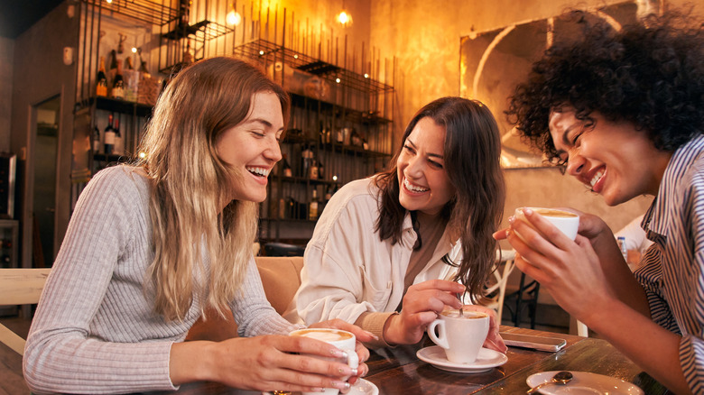 Group of women drinking coffee in a cafe