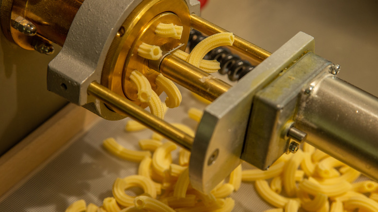 a bronze die extruder with pasta