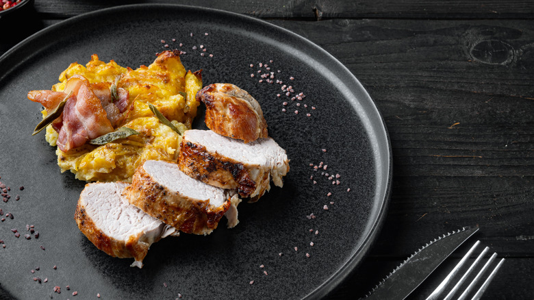 potatoes plated with prosciutto