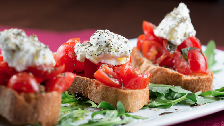 bruschetta with tomatoes, basil, and ricotta salata