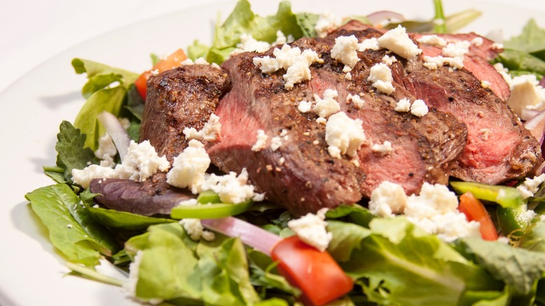 filet mignon on arugula with feta