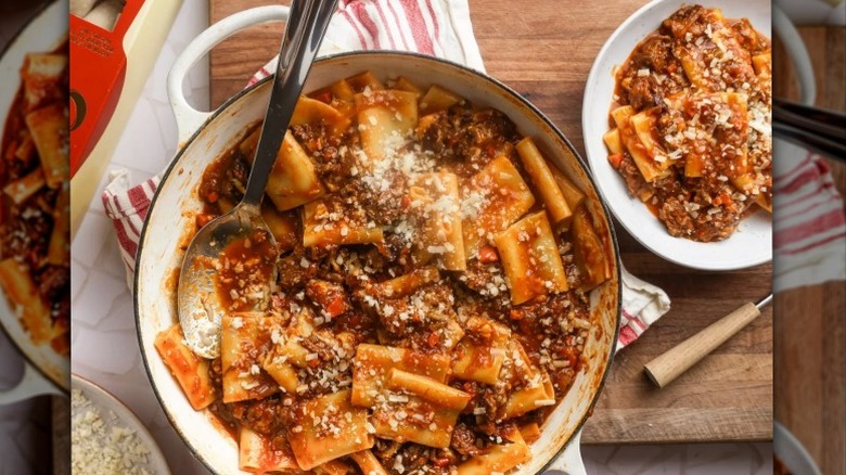 Giada De Laurentiis' Beef And Caramelized Onion Ragù in white pot with plated serving