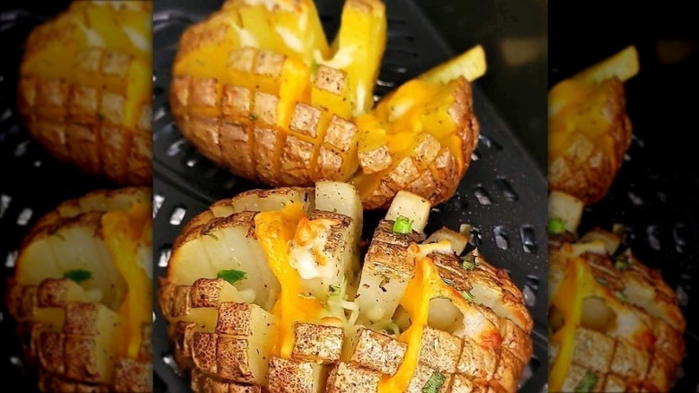 blooming baked potato with cheese on top