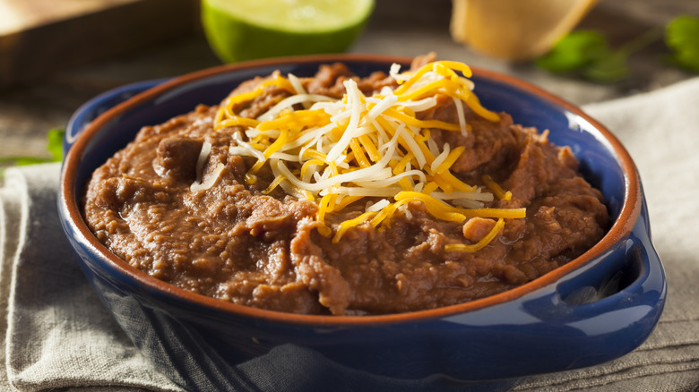 Mexican refried beans topped with cheese