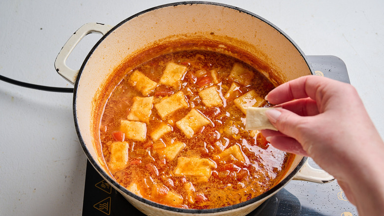 Paprikash chicken and dumplings in pot