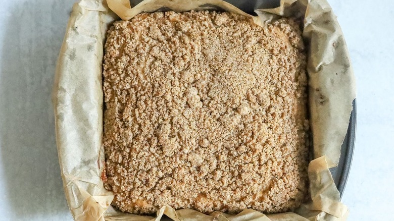 Baked crumb coffee cake in baking pan