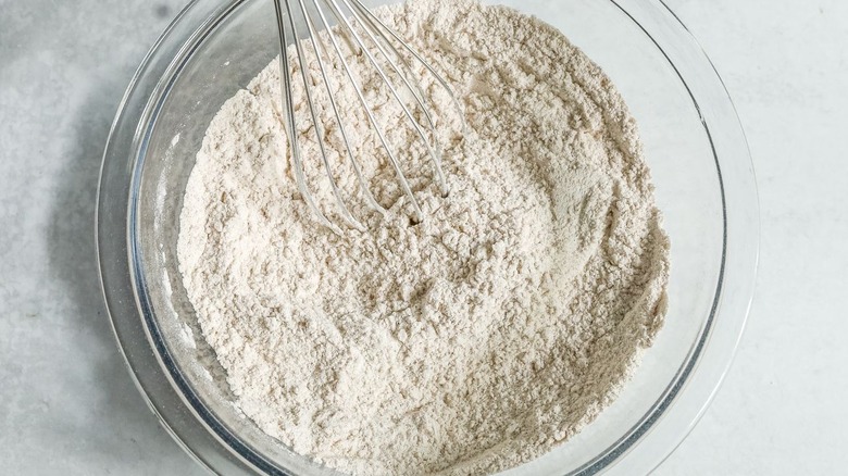Flour mixture in bowl with whisk