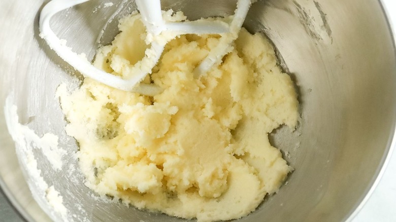 Butter and sugar mixture in bowl with paddle attachment