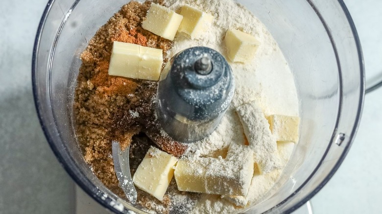 Cubed butter and sugars in food processor