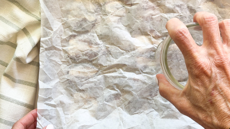 hand pressing down on dates