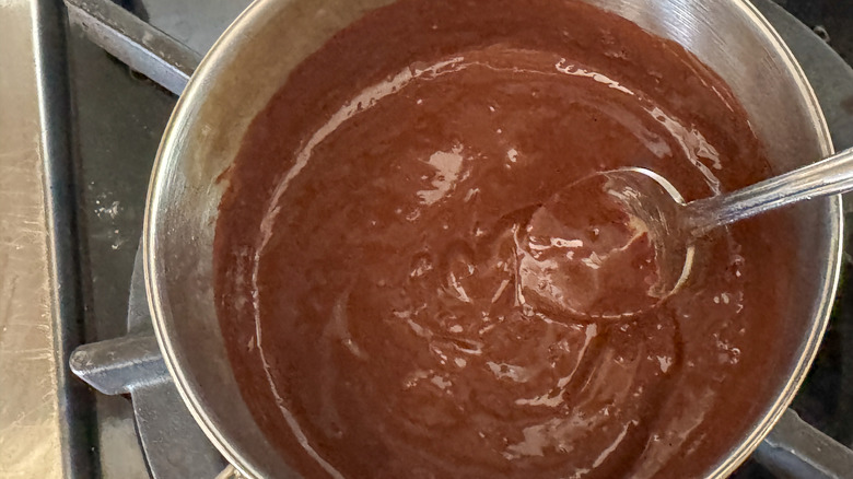 spoon in pot of chocolate