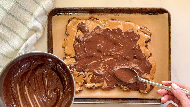 hand spreading chocolate