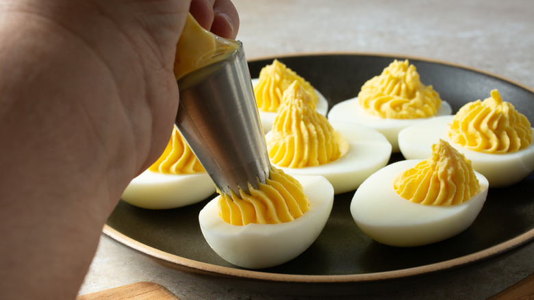 preparing deviled eggs
