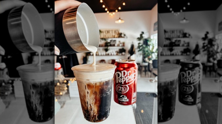 Pumpkin spice cold foam being poured over soda, next to Dr Pepper can