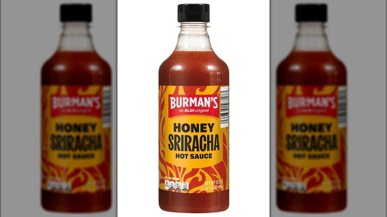 A bottle of Burman's Honey Sriracha Hot Sauce from Aldi on a white background