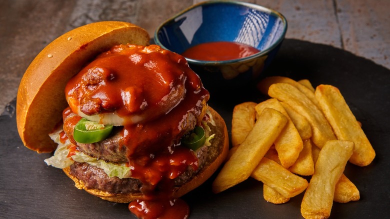 hamburger with fries and sauce