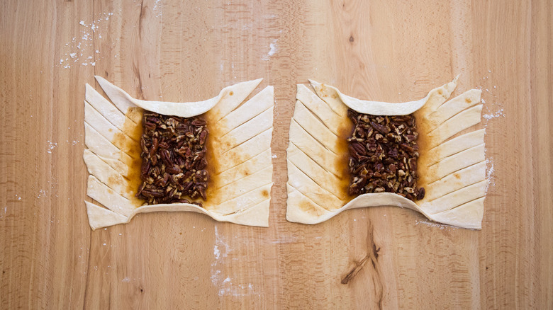 partially made pastries on table