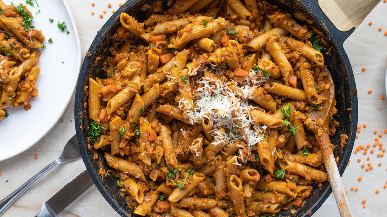 A skillet of lentil bolognese pasta