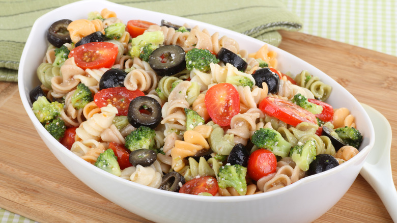 Close-up of tri-color pasta salad with black olives