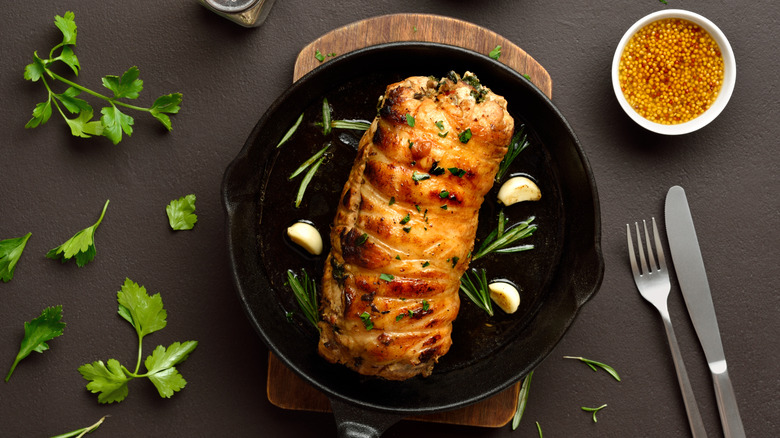 A pork roast on a skillet