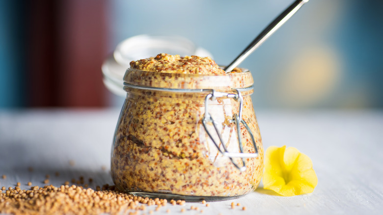 Creole mustard in clear jar with spoon