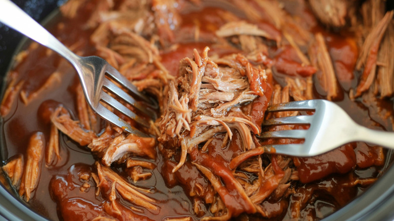 Close-up of pulled pork in a slow cooker