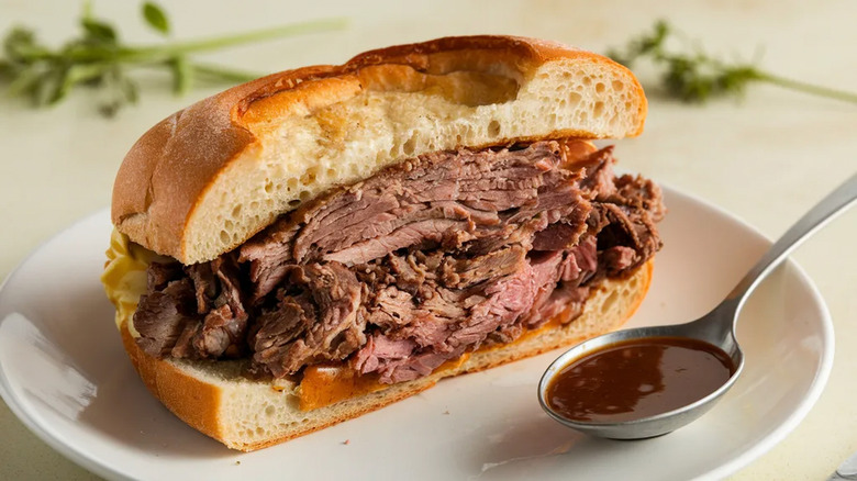 Roast beef sandwich with spoon of au jus