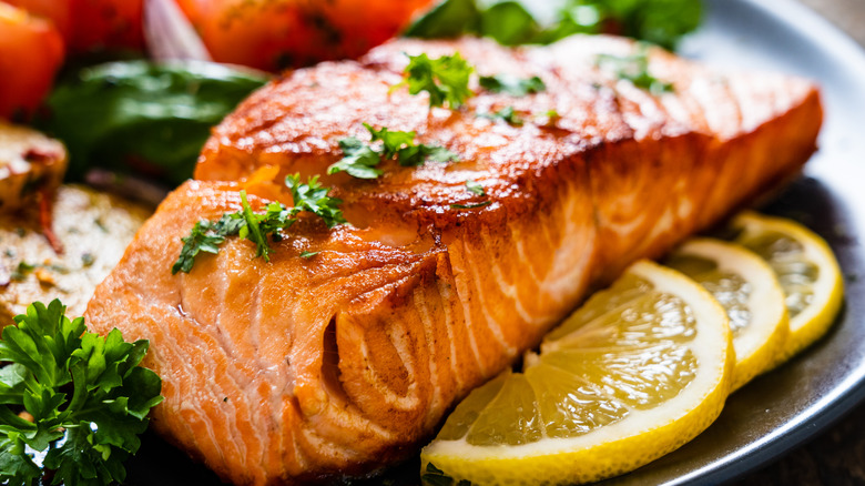 grilled salmon plated with veggies