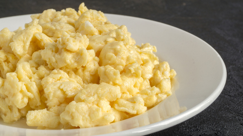 A close up of fresh scrambled eggs in a plate