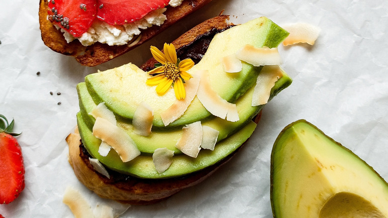 avocado toast topped with toasted coconut