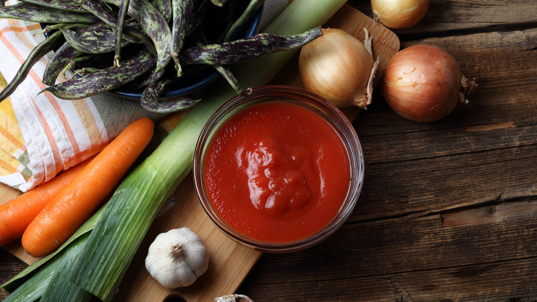 Tomato paste, onions, leeks, and carrots