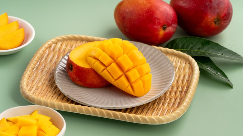 Fresh mango scored in a crisscross pattern