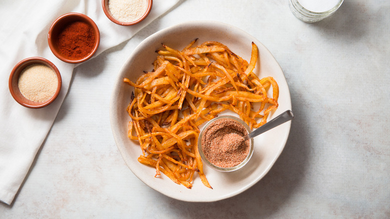 seasoned fries served on table