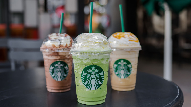 Various Starbucks frappuccinos on a table